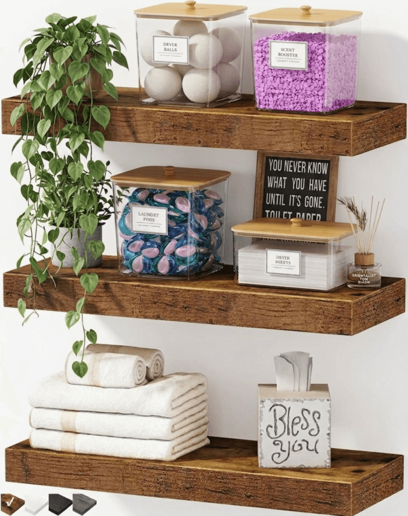 floating wooden shelves in small laundry room with towels, plants and laundry storage decor ideas