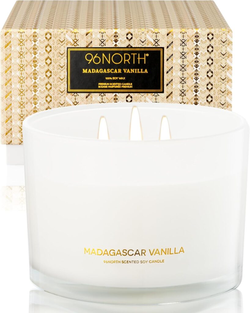 vanilla soy candle on bathroom shelf creating warm calming atmosphere without visual clutter