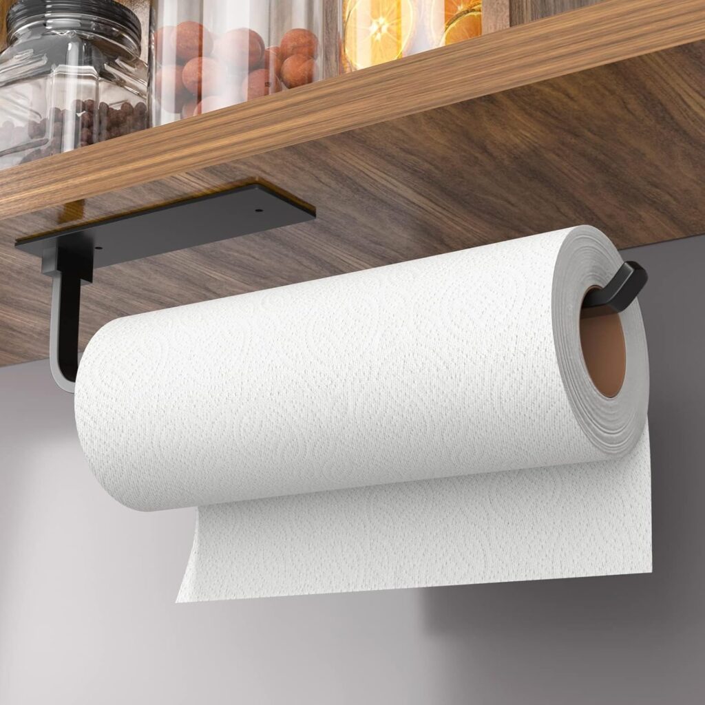 Under-cabinet paper towel holder freeing up valuable counter space in a small apartment kitchen