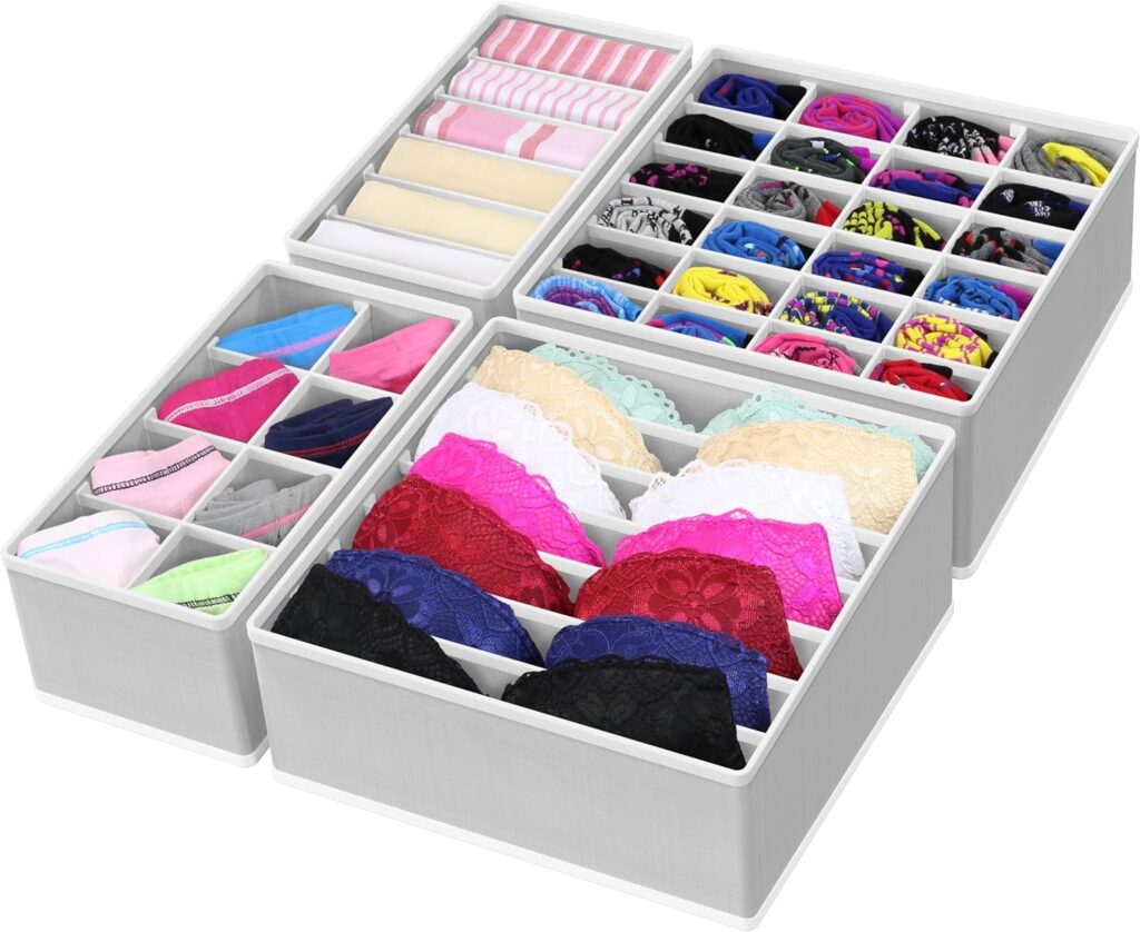 Clear acrylic drawer organizers stacked neatly for socks, underwear, and small clothing accessories in a calm closet system