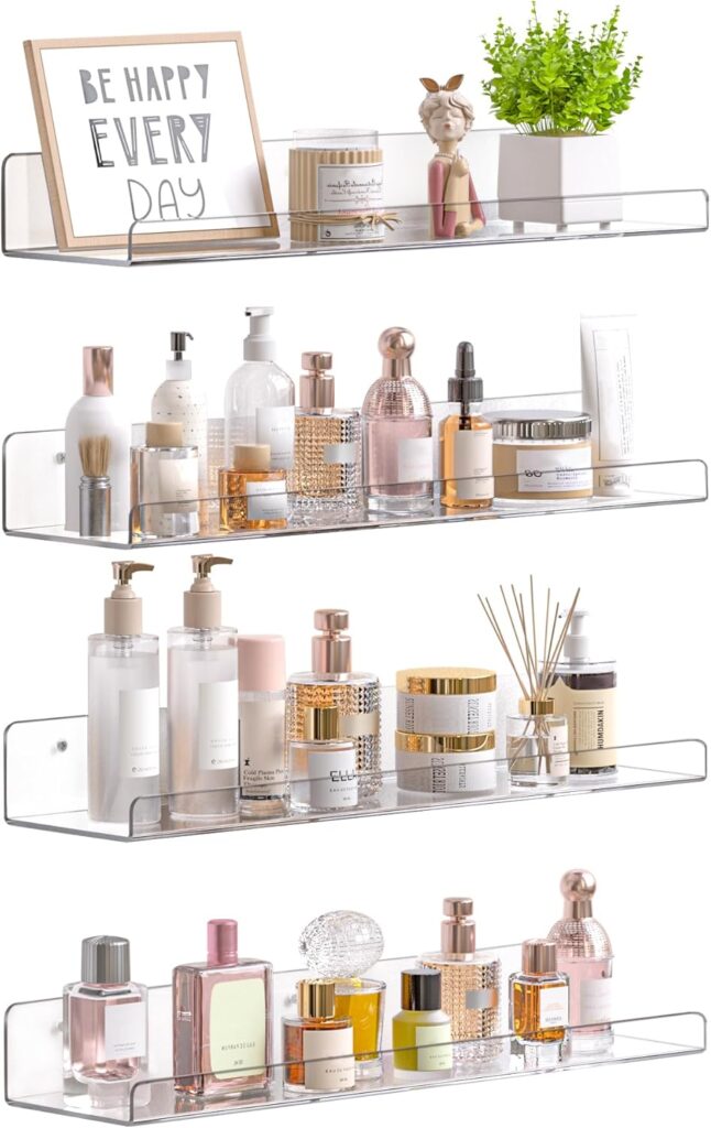 Clear acrylic floating bathroom shelves organizing skincare, perfume, and beauty products while keeping the counter clutter-free.