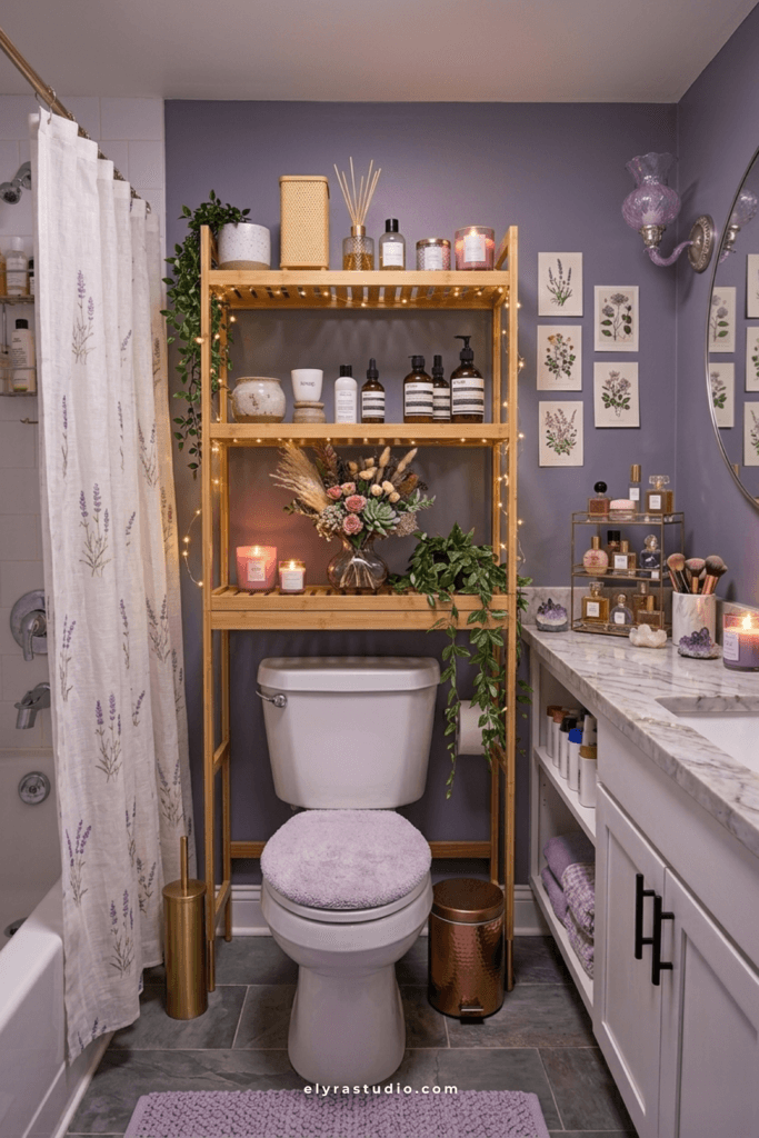 Modern bathroom with a gold over the toilet storage shelf, folded towels, baskets, greenery, and elegant neutral decor.